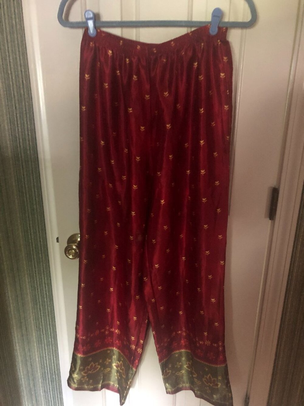 A silky flowy multi colored and designed pair of pants Sz lg